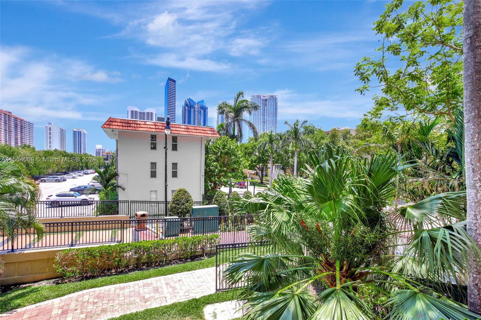 17150 North Bay Road, Unit 2216 Sunny Isles Beach, FL 33160 - Photo 8 of 46 a front view of a house with a yard