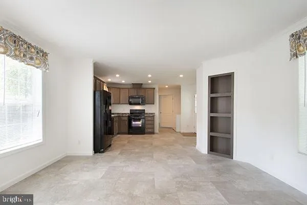 a view of a kitchen with a sink and a window