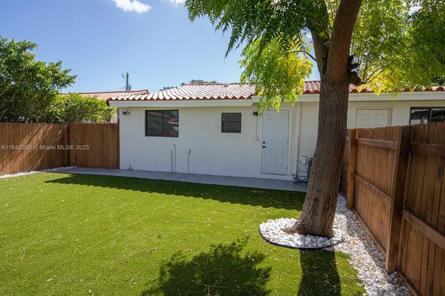 a front view of house with garden