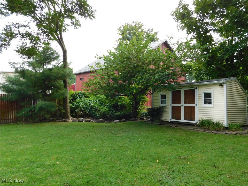 3470 County Line Road Madison, OH 44057 - Photo 14 of 48 View of yard featuring a shed