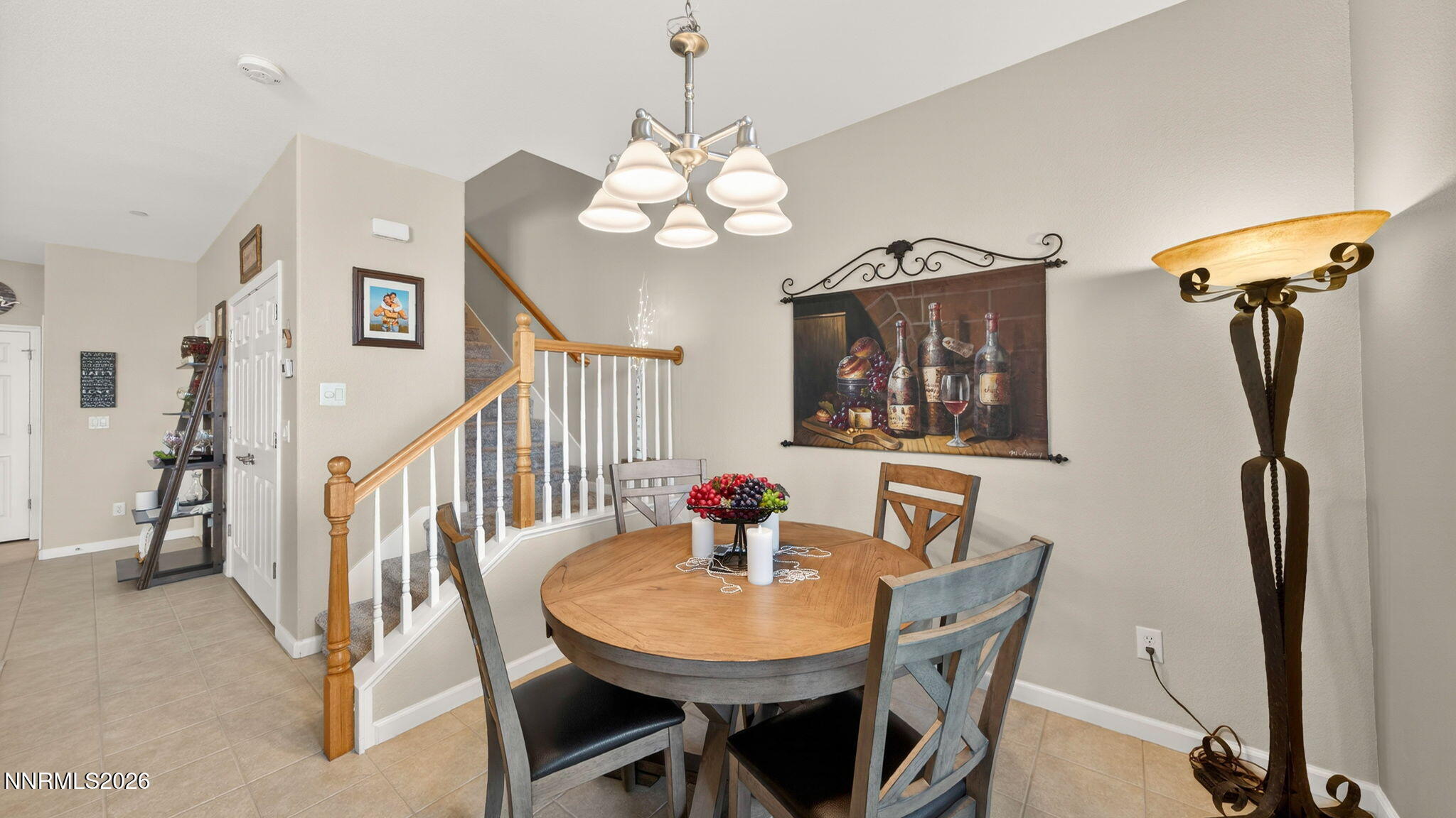 1750 Wind Ranch Road, Unit B Reno, NV 89521 - Photo 12 of 42 a view of a dining room with furniture and a chandelier
