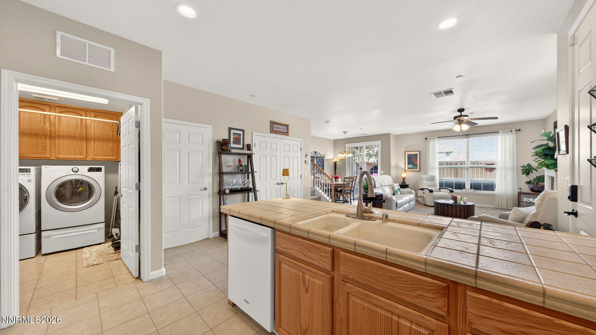 1750 Wind Ranch Road, Unit B Reno, NV 89521 - Photo 17 of 42 a view of a kitchen area with furniture and washer dryer