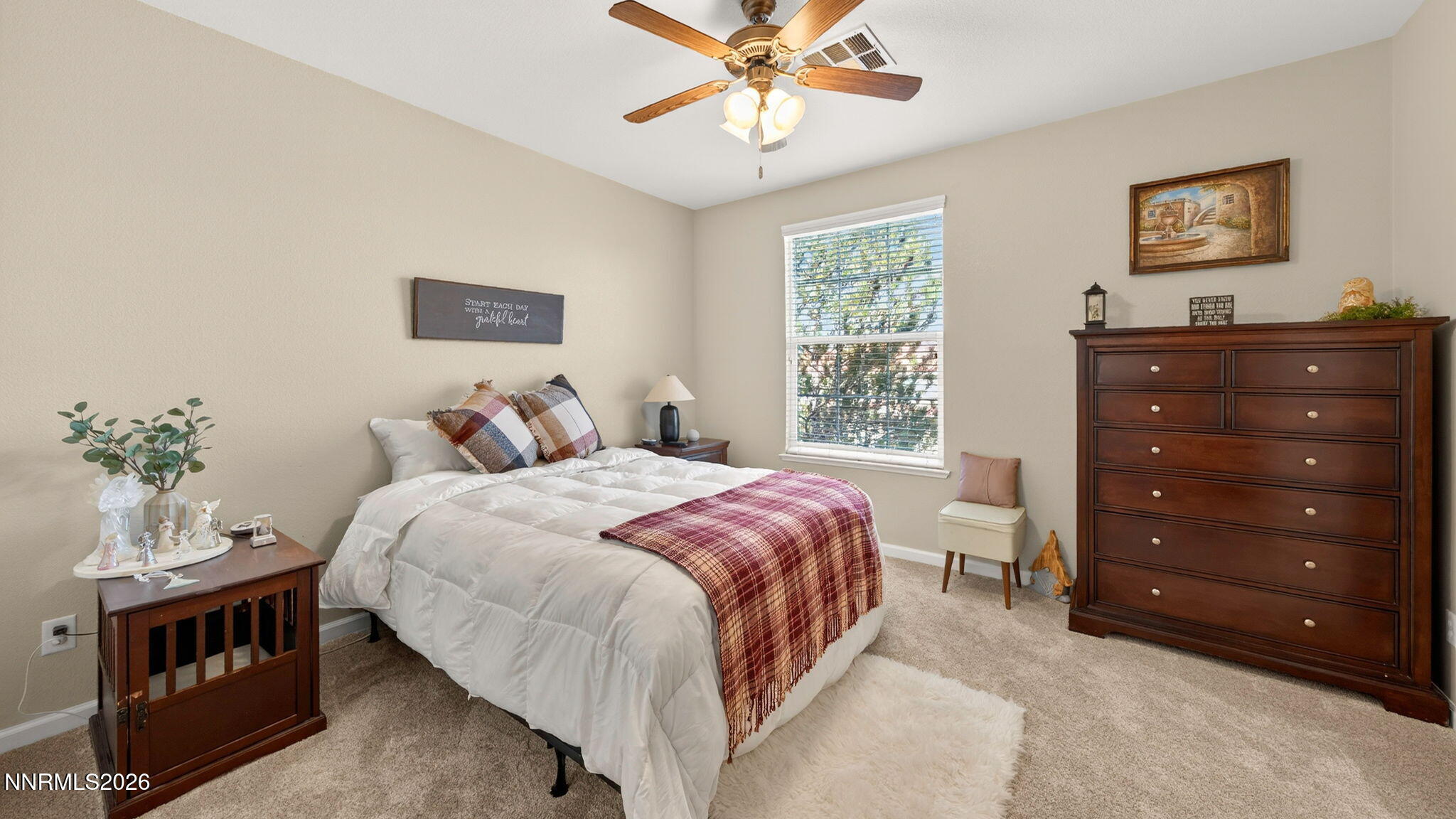 1750 Wind Ranch Road, Unit B Reno, NV 89521 - Photo 20 of 42 a bedroom with a bed a rug and a window