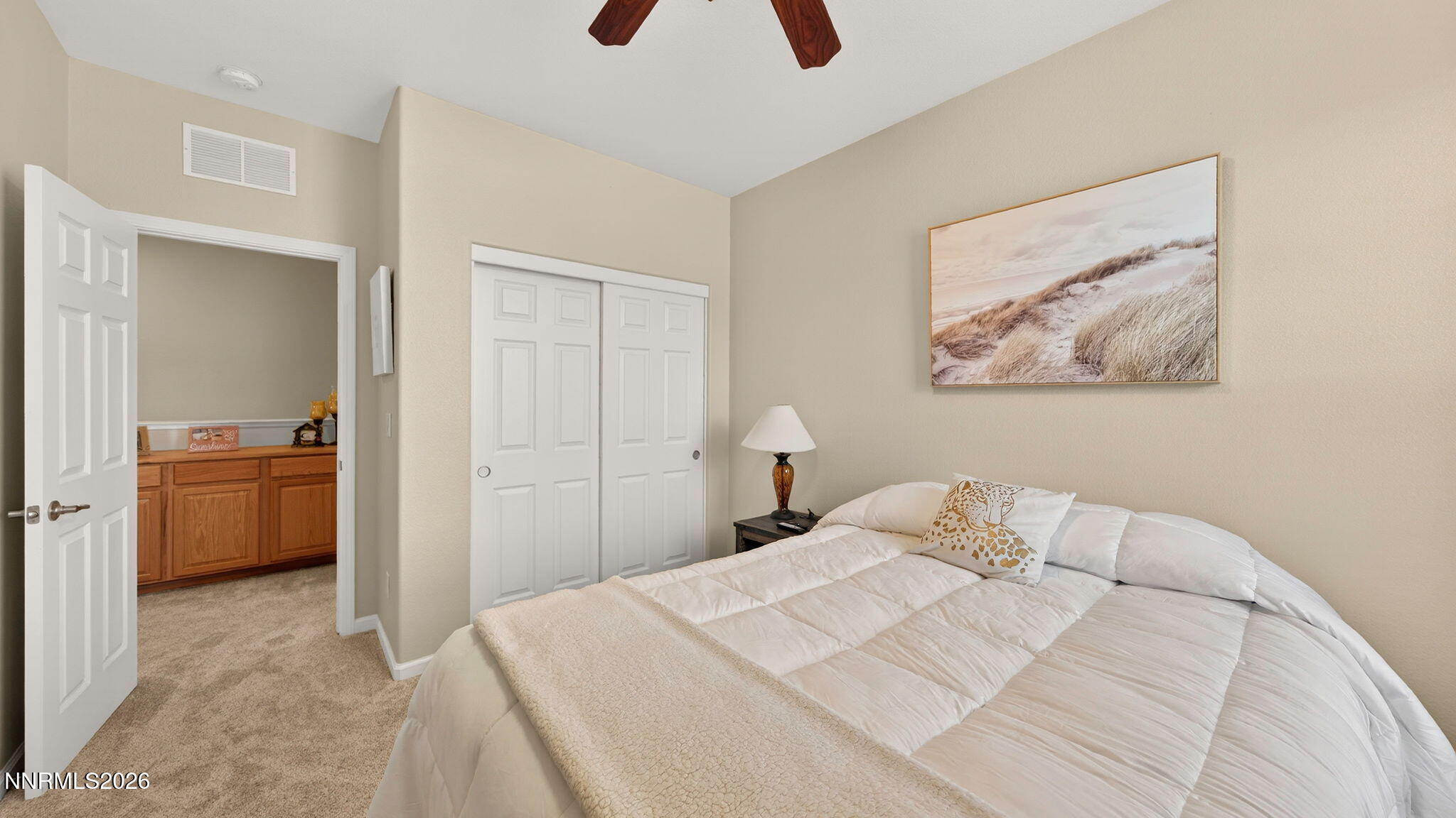 1750 Wind Ranch Road, Unit B Reno, NV 89521 - Photo 23 of 42 a bedroom with a bed and a view of bathroom