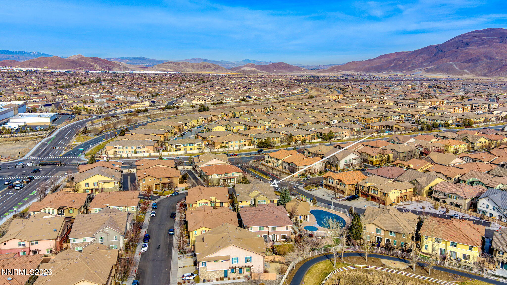 1750 Wind Ranch Road, Unit B Reno, NV 89521 - Photo 41 of 42 an aerial view of a city with lots of residential buildings