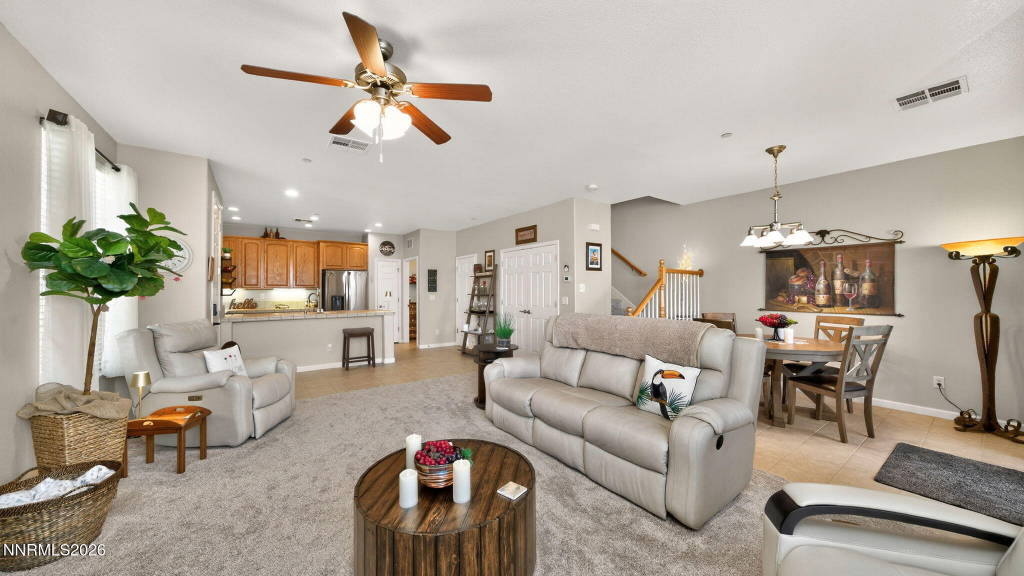 1750 Wind Ranch Road, Unit B Reno, NV 89521 - Photo 9 of 42 a living room with furniture kitchen view and a chandelier