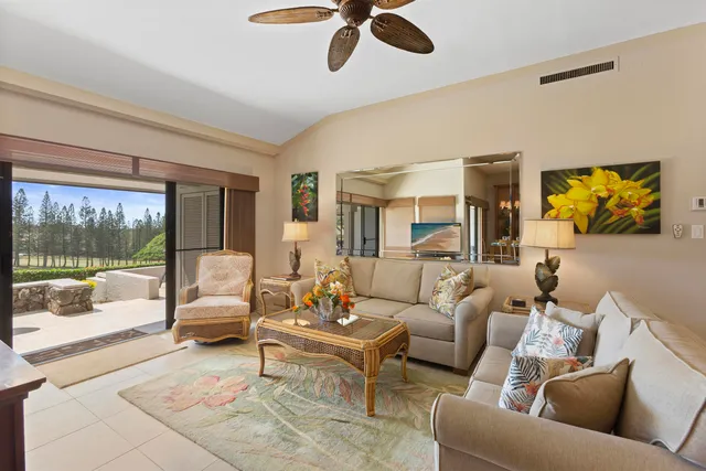 a kitchen with stainless steel appliances lots of white furniture cabinets and a large window