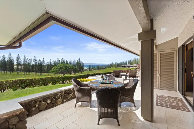 a bathroom with a granite countertop sink and a large mirror
