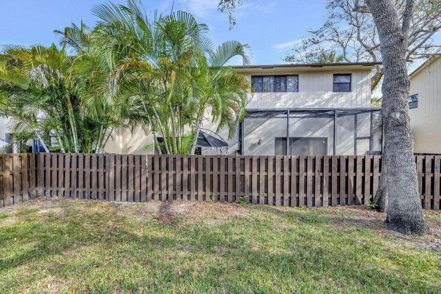 7610 Northwest 79th Avenue, Unit I5 Fort Lauderdale, FL 33321 - Photo 16 of 22 a view of a wooden fence