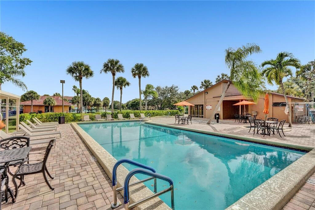 7610 Northwest 79th Avenue, Unit I5 Fort Lauderdale, FL 33321 - Photo 20 of 22 a view of a swimming pool with a patio