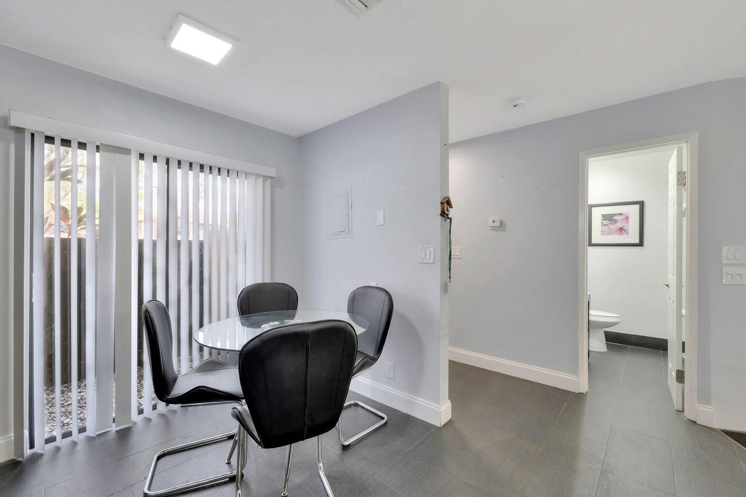 7610 Northwest 79th Avenue, Unit I5 Fort Lauderdale, FL 33321 - Photo 3 of 22 a view of a workspace with furniture and a window