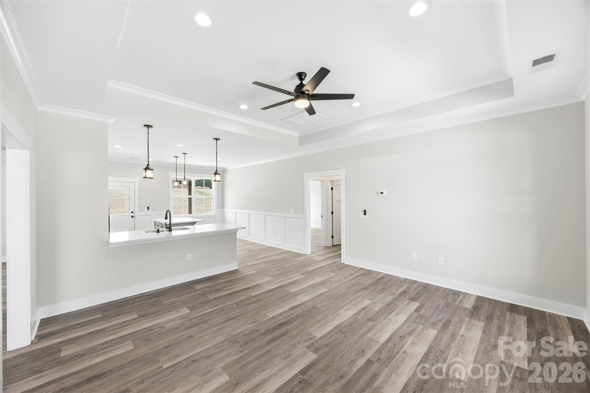 1014 Speight Road Albemarle, NC 28001 - Photo 4 of 28 a view of a kitchen with wooden floor and a sink
