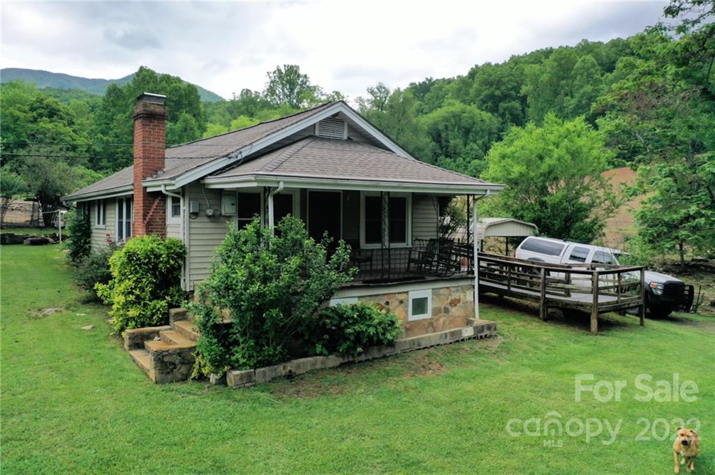 826 Monteith Branch Road Sylva, NC 28779 - Photo 2 of 14 a view of a house with a yard and deck area