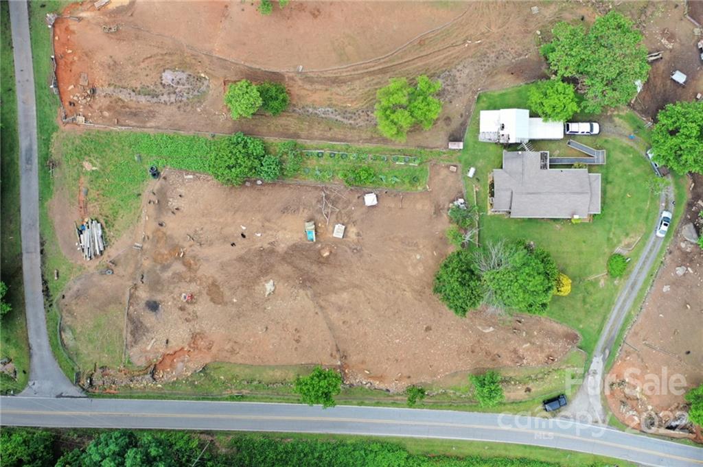 826 Monteith Branch Road Sylva, NC 28779 - Photo 3 of 14 an aerial view of a house with a yard and garden