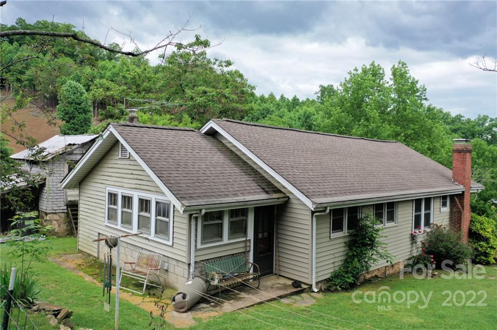 826 Monteith Branch Road Sylva, NC 28779 - Photo 4 of 14 a aerial view of a house with yard and plants