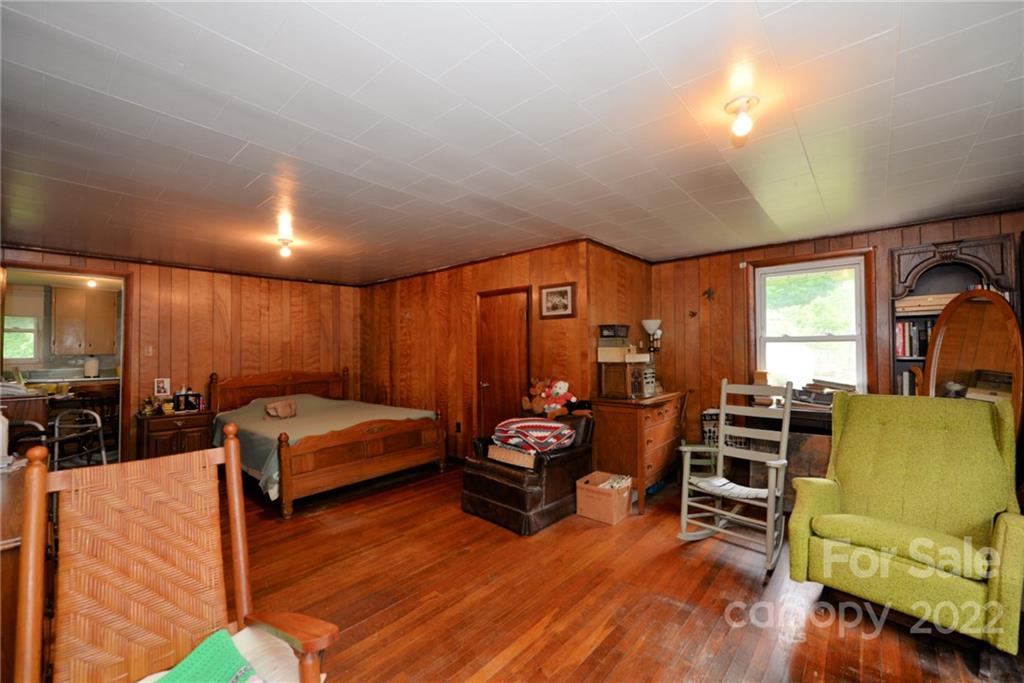 826 Monteith Branch Road Sylva, NC 28779 - Photo 7 of 14 a living room with furniture and a flat screen tv