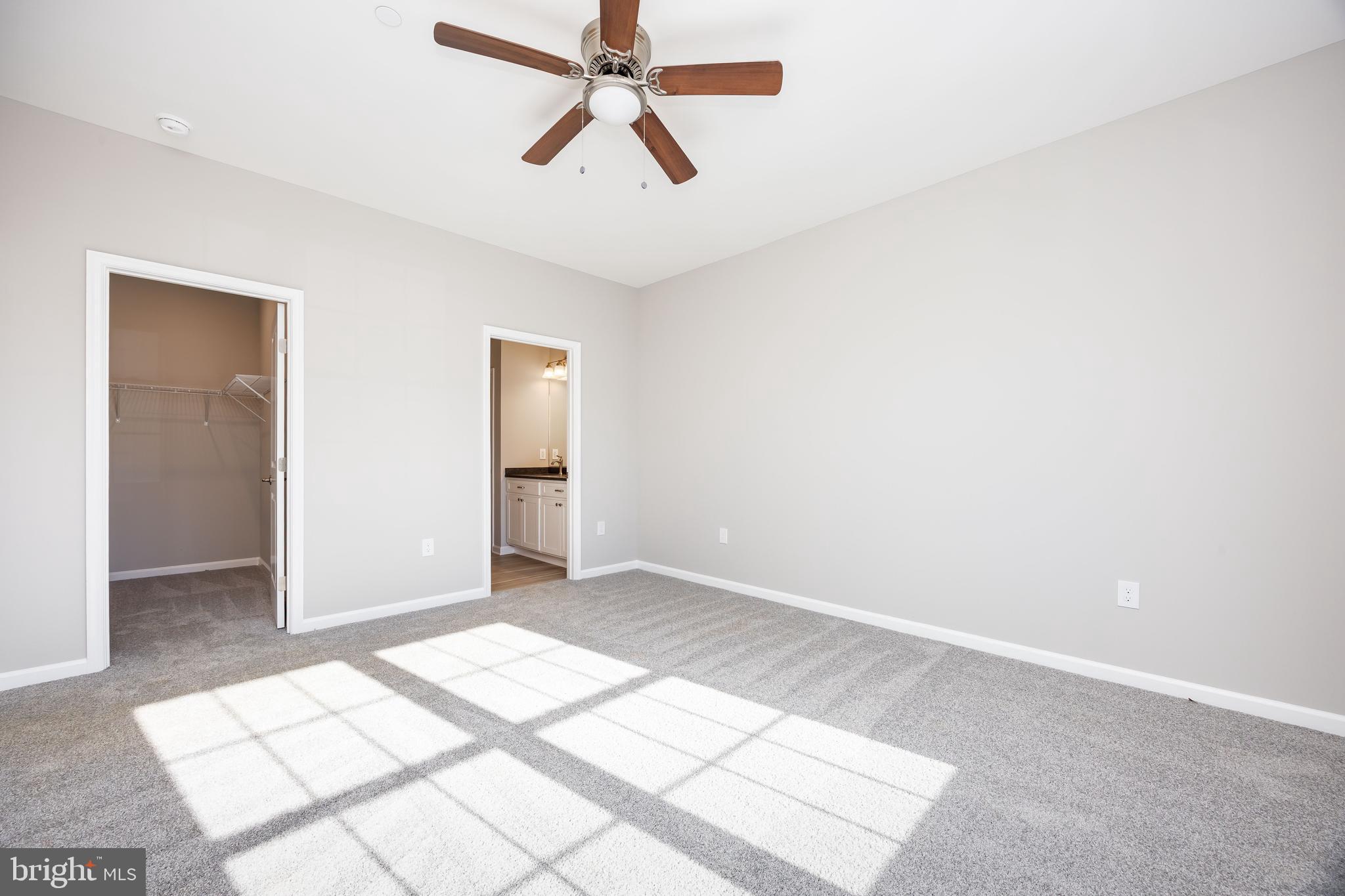 11779 St Stephens Way Princess Anne, MD 21853 - Photo 22 of 51 a view of a big room with wooden floor and windows in a room