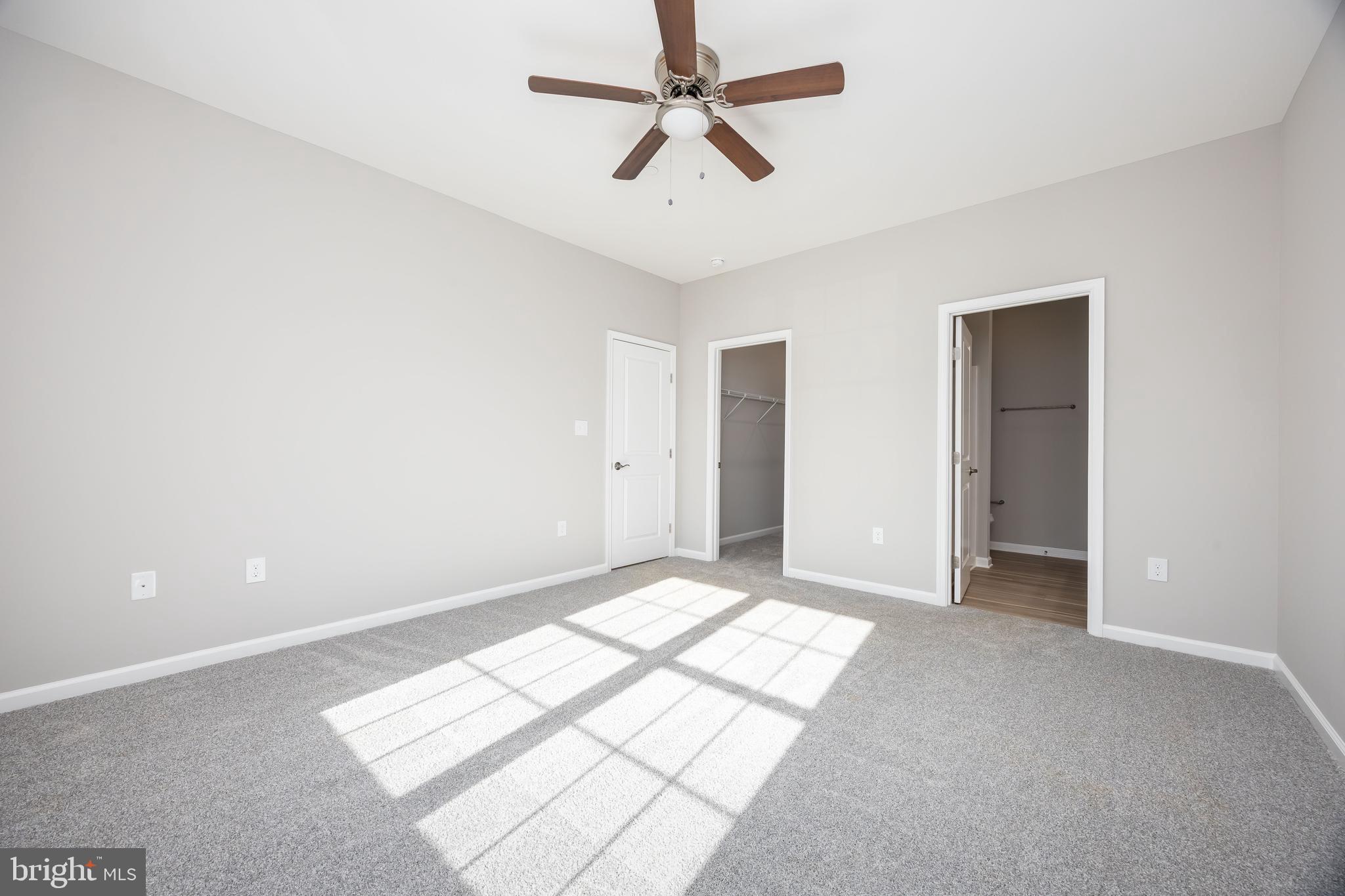 11779 St Stephens Way Princess Anne, MD 21853 - Photo 23 of 51 a view of an empty room and window and a ceiling fan