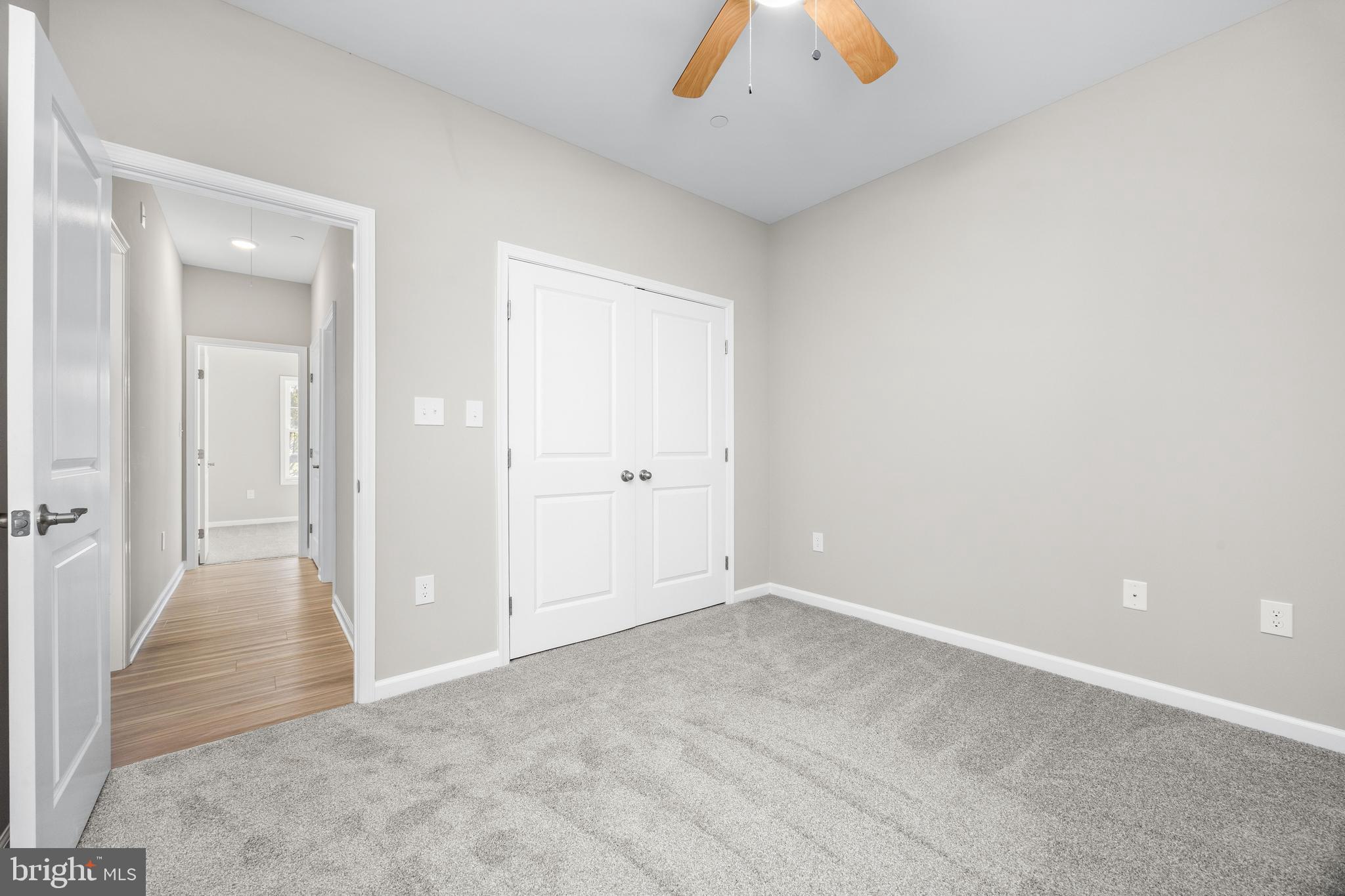 11779 St Stephens Way Princess Anne, MD 21853 - Photo 33 of 51 an empty room with closet and a chandelier fan