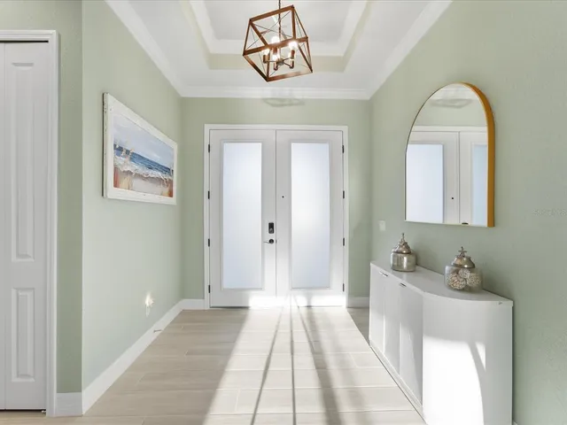 a dining room with a table and chairs