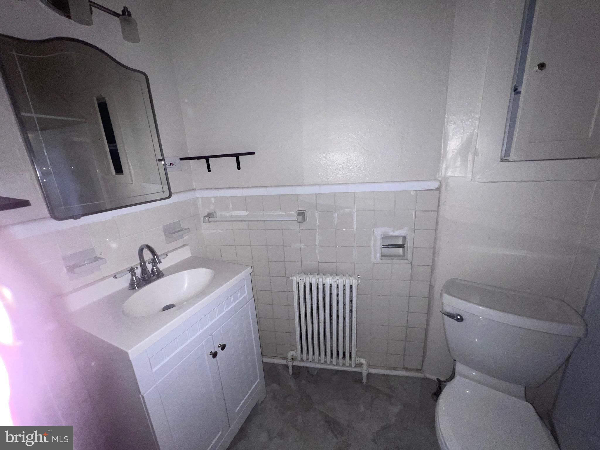 144 West Patrick Street, Unit 4 Frederick, MD 21701 - Photo 14 of 16 a bathroom with a sink and toilet