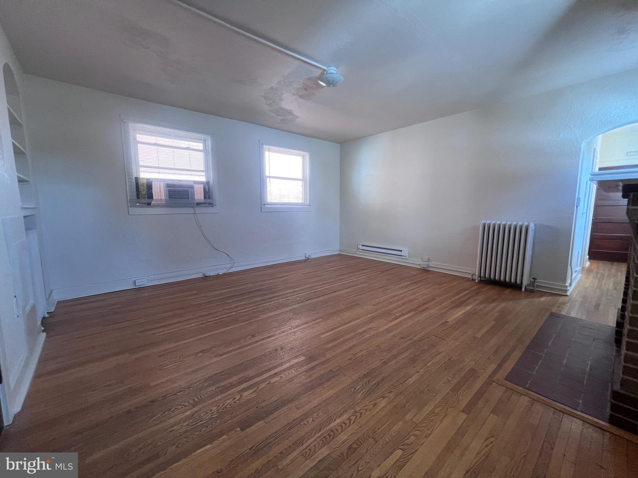 144 West Patrick Street, Unit 4 Frederick, MD 21701 - Photo 4 of 16 a view of empty room with wooden floor and fan