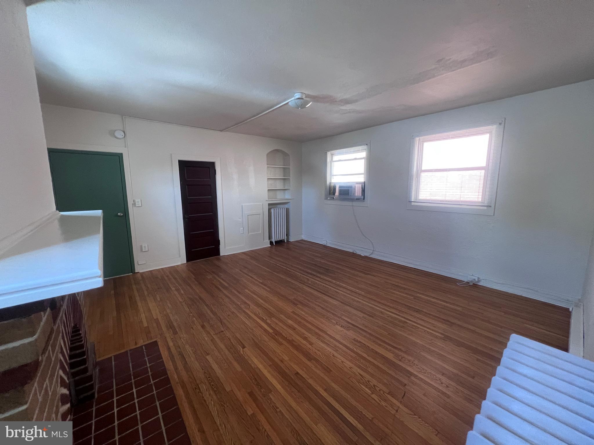 144 West Patrick Street, Unit 4 Frederick, MD 21701 - Photo 5 of 16 a view of a room with wooden floor and window