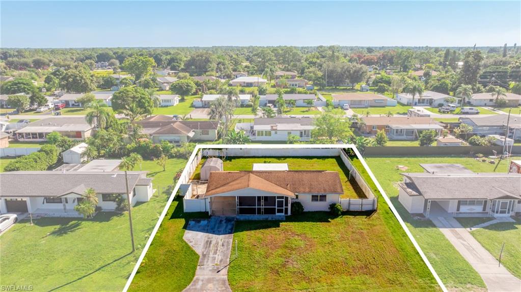 339 Beachwood Road Lehigh Acres, FL 33936 - Photo 30 of 32 Aerial perspective of suburban area featuring property boundaries highlighted