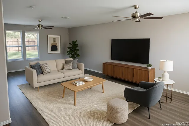 a living room with furniture and a flat screen tv