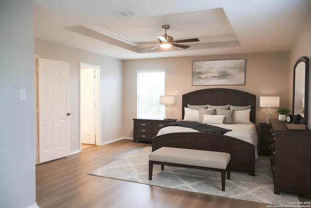 a bedroom with a bed a couch and window