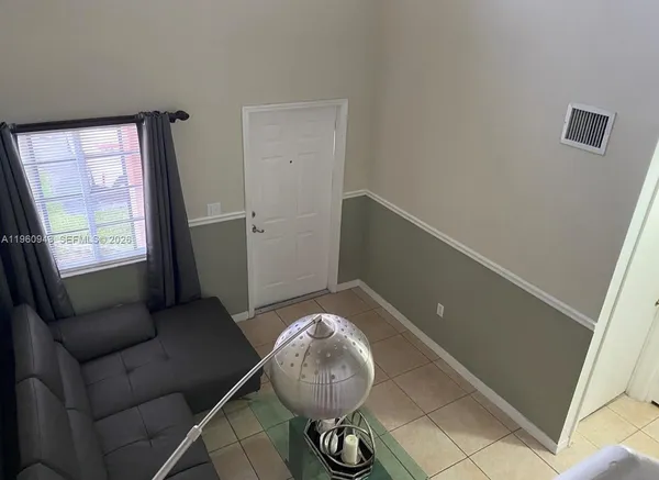 a living room with furniture and a window