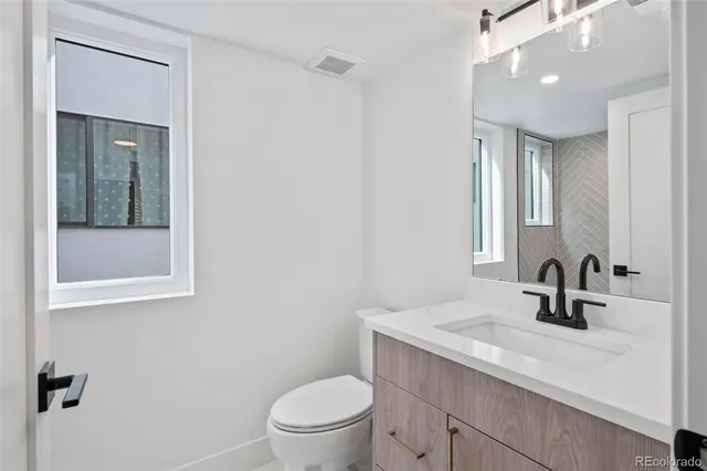 a kitchen with a sink cabinets and window