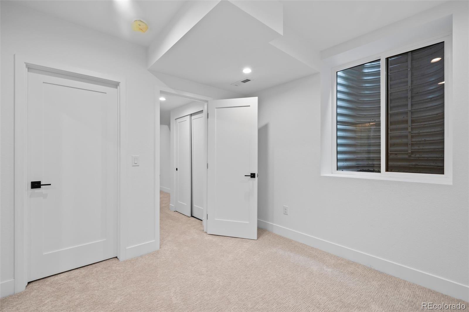 2453 Lawrence Street, Unit 1 Denver, CO 80205 - Photo 40 of 48 a view of an empty room with a window