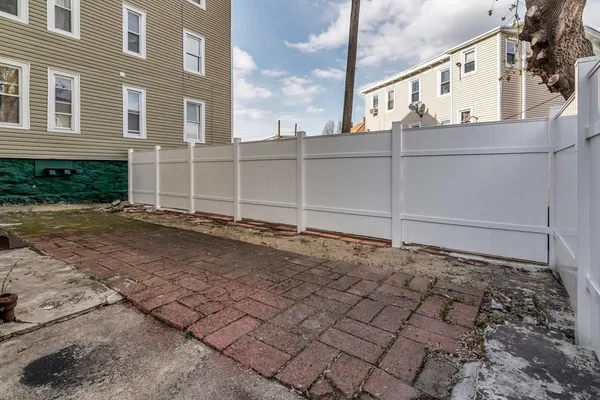 a view of a backyard of a house