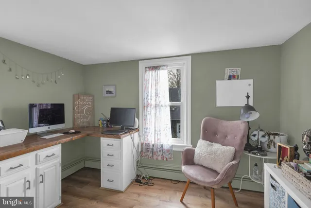 a workspace with furniture and a window