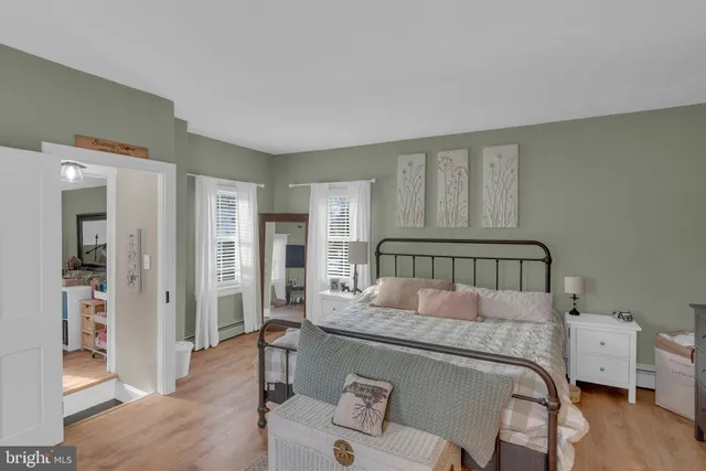 a bedroom with a bed and a couch