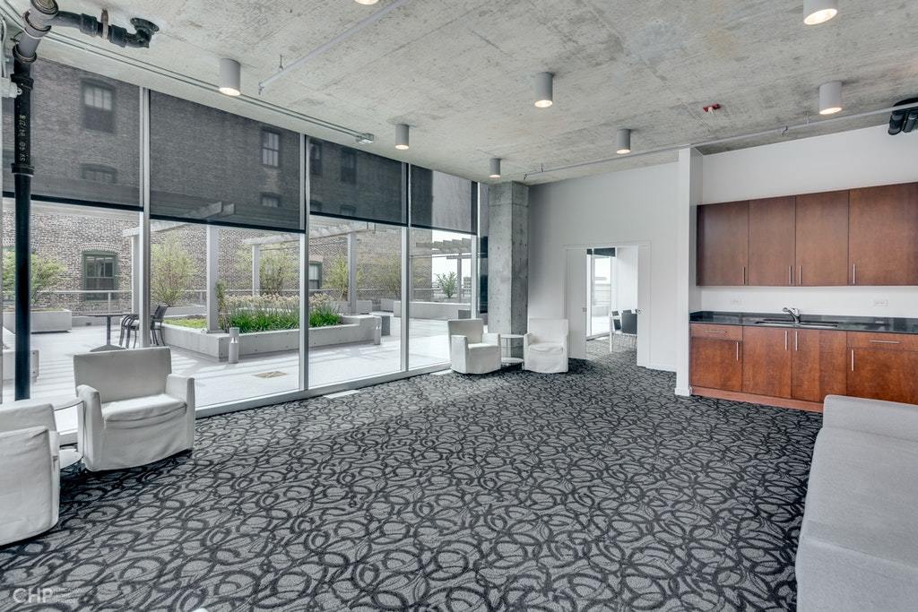 611 South Wells Street, Unit 809 Chicago, IL 60607 - Photo 14 of 14 a large room with a large window