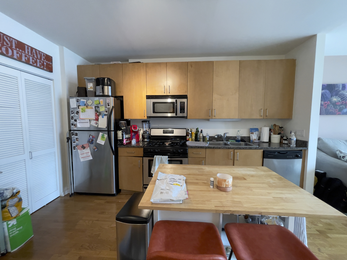 611 South Wells Street, Unit 809 Chicago, IL 60607 - Photo 4 of 14 a kitchen with stainless steel appliances granite countertop a refrigerator stove top oven a sink and dishwasher