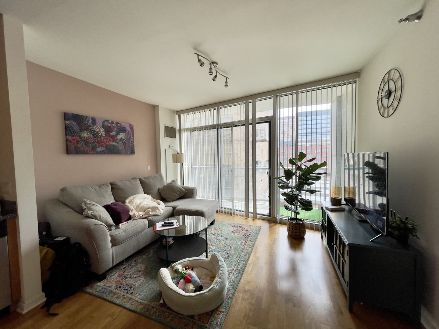 611 South Wells Street, Unit 809 Chicago, IL 60607 - Photo 5 of 14 a living room with furniture and a large window