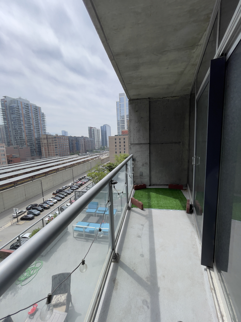 611 South Wells Street, Unit 809 Chicago, IL 60607 - Photo 6 of 14 a view of a balcony with an outdoor space