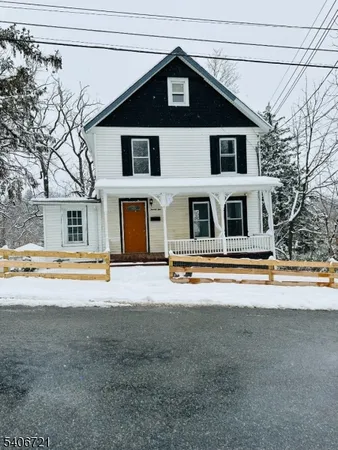 a front view of a house with a swimming pool