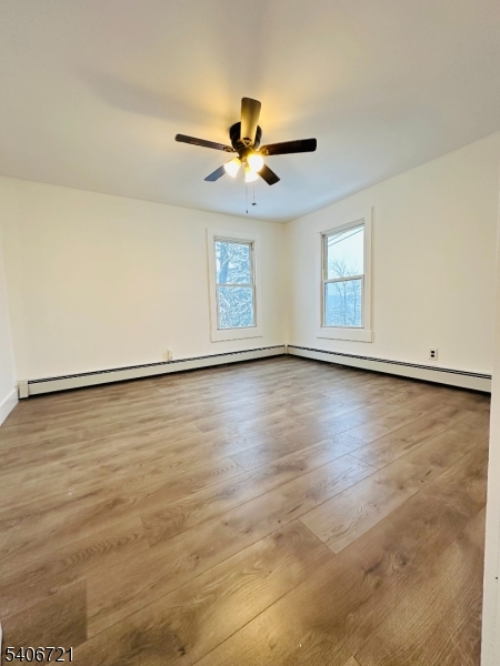 22 Harrison Street Sussex, NJ 07461 - Photo 16 of 23 wooden floor in an empty room with a window