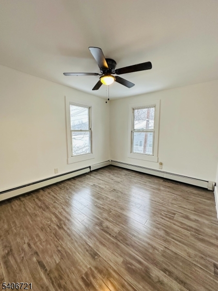22 Harrison Street Sussex, NJ 07461 - Photo 18 of 23 an empty room with wooden floor and windows