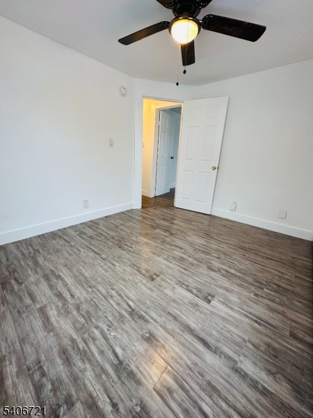 22 Harrison Street Sussex, NJ 07461 - Photo 19 of 23 an empty room with wooden floor fan and window