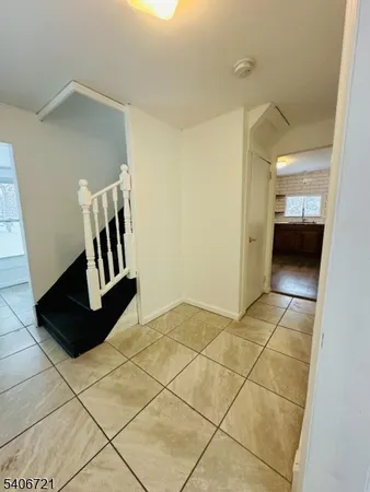 a kitchen with stainless steel appliances a refrigerator a sink a stove a microwave a center island and a window