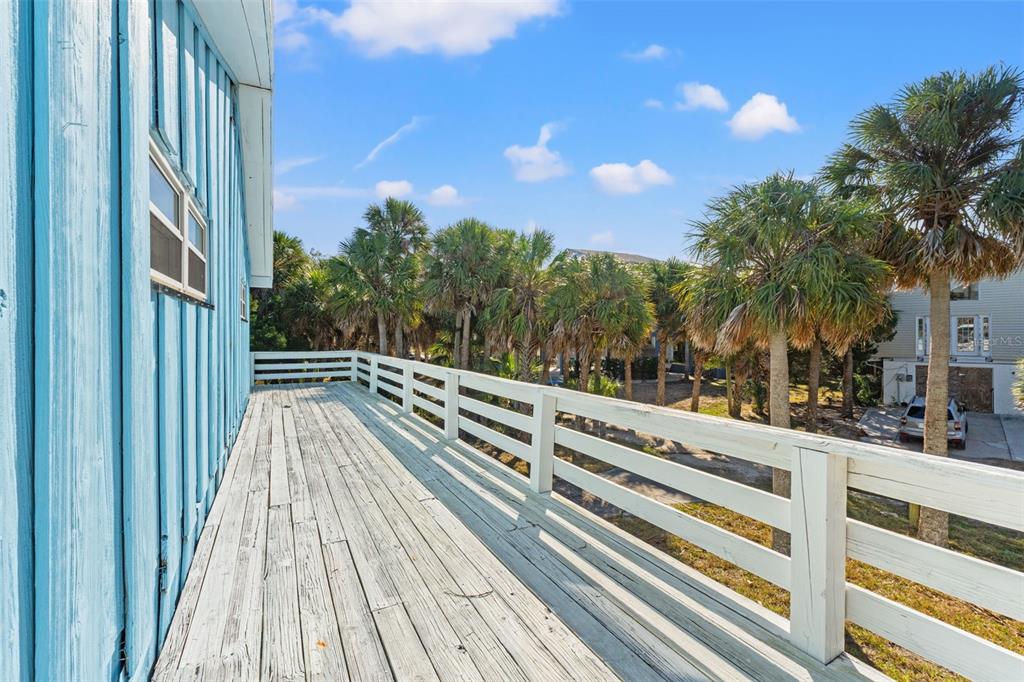 3461 Gum Drive Weeki Wachee, FL 34607 - Photo 11 of 48 a view of balcony with wooden floor and fence