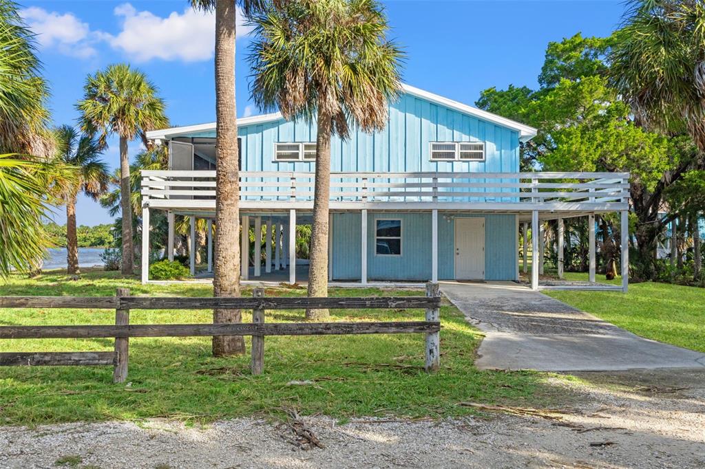 3461 Gum Drive Weeki Wachee, FL 34607 - Photo 15 of 48 a front view of a house with a yard