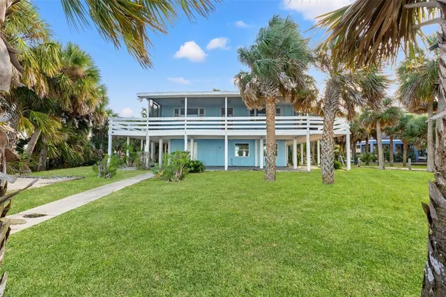 a view of a swimming pool with a yard