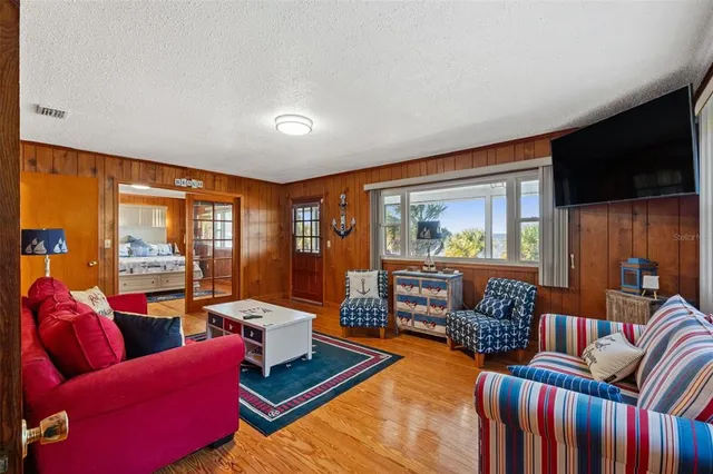 a living room with furniture fireplace and rug