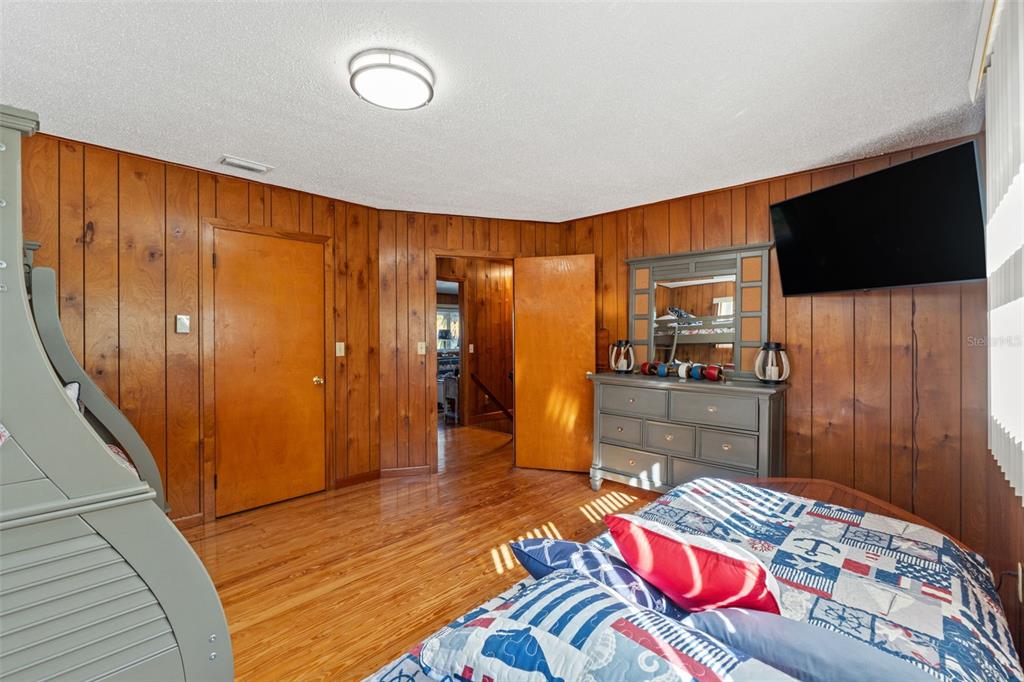 3461 Gum Drive Weeki Wachee, FL 34607 - Photo 27 of 48 a bedroom with a bed and a television